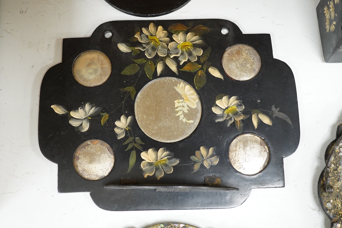 A collection of Victorian papier maché to include an inkstand, a pair of Victorian mirrored wall brackets and a swing handled dish, largest 30cm high